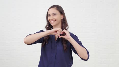 Heart-gesture-shown-by-an-Indian-girl