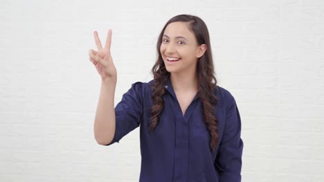 Indian-girl-showing-Peace-sign