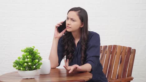 Angry-Indian-girl-talking-on-a-call