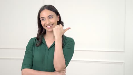 Indian-girl-pointing-at-Copy-space