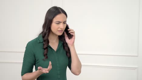 Sad-Indian-girl-talking-on-a-call
