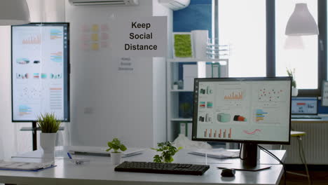 Modern-empty-office-with-plastic-separators-and-keep-social-distance-poster