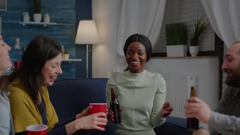 Woman-with-black-skin-gathering-late-at-night-with-friends-in-living-room