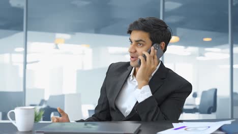 Happy-Indian-businessman-talking-on-phone