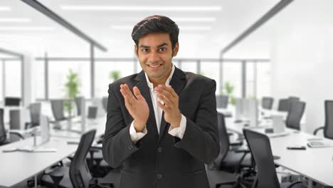 Happy-Indian-manager-clapping-and-motivating-employees