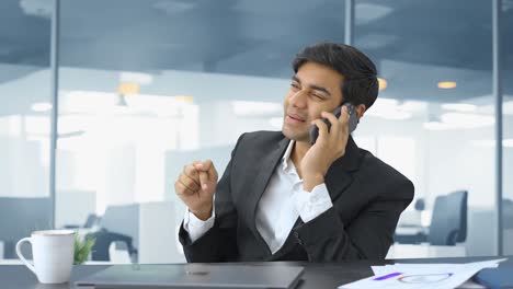 Angry-Indian-manager-talking-on-phone