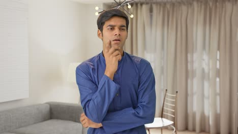 Young-Indian-man-thinking-and-observing
