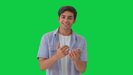 Cute-Indian-boy-inviting-someone-Green-screen