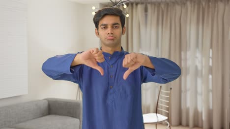 Disappointed-Indian-man-showing-thumbs-down