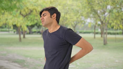 Young-Indian-boy-having-back-pain