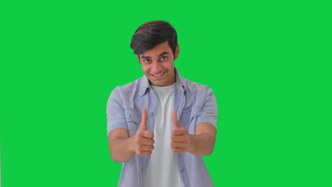 Happy-Indian-boy-showing-thumbs-up-sign-Green-screen