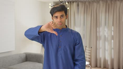 Unhappy-Indian-man-showing-thumbs-down