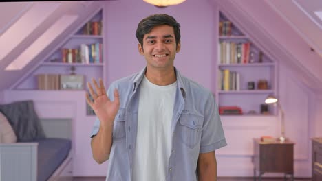 Indian-boy-waving-hand-and-saying-hello
