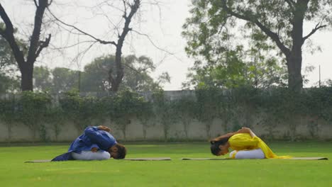 Indian-couple-doing-reverse-Namaste-yoga-exercise