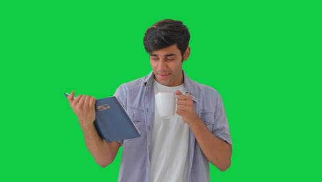 Bored-and-tired-Indian-man-reading-a-book-Green-screen