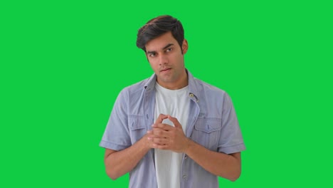 Angry-Indian-young-boy-showing-aggression-Green-screen
