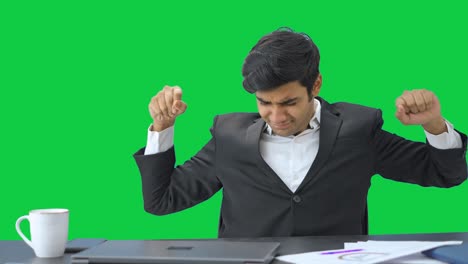 Tired-and-lazy-Indian-employee-goes-to-sleep--Green-screen