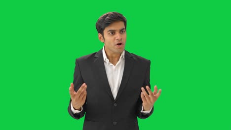 Angry-Indian-businessman-shouting-on-employees-Green-screen