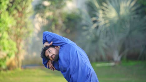 Indian-man-stretching-and-doing-yoga