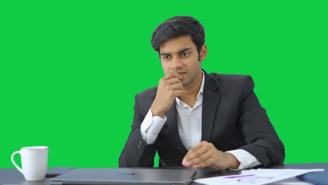 Stressed-Indian-employee-working--Green-screen