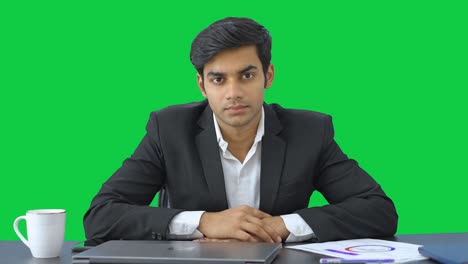 Indian-businessman-listening-to-employees-Green-screen
