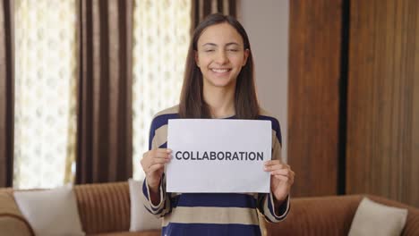Happy-Indian-woman-holding-COLLABORATION-banner