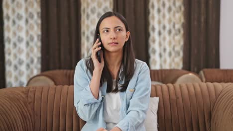 Indian-woman-talking-to-someone-on-call