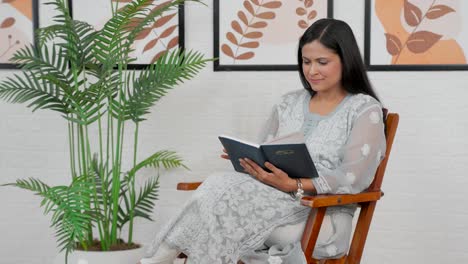 Indian-woman-finish-reading-book