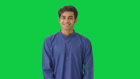 Happy-Indian-man-listening-to-someone-Green-screen