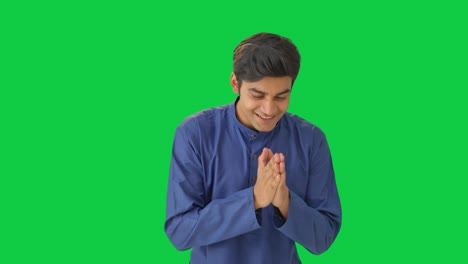 Happy-Indian-man-greeting-everybody-with-namaste-Green-screen