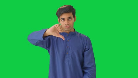 Unhappy-Indian-man-showing-thumbs-down-Green-screen