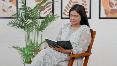 Indian-woman-thinking-after-reading-book