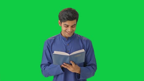 Cute-Indian-boy-reading-and-thinking-something-Green-screen