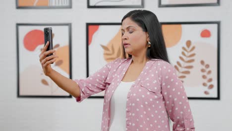 Sad-Indian-woman-taking-on-video-call