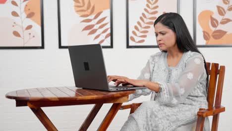 Woman-working-on-laptop-at-home