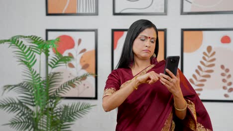 Tired-Indian-woman-scrolling-phone
