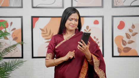 Happy-Indian-woman-using-phone