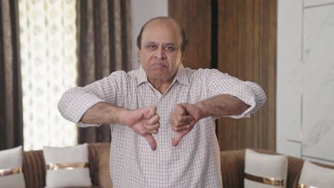 Upset-Indian-old-man-showing-thumbs-down