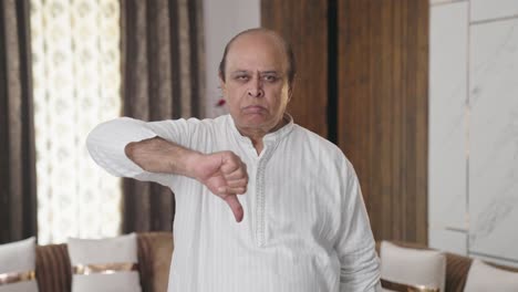 Upset-old-Indian-man-showing-thumbs-down
