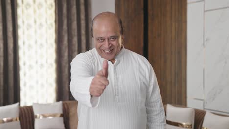 Happy-Indian-old-uncle-cheering-and-showing-thumbs-up