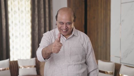 Happy-Indian-old-man-showing-thumbs-up-to-the-camera