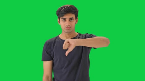 Disappointed-Indian-man-showing-thumbs-down--Green-screen