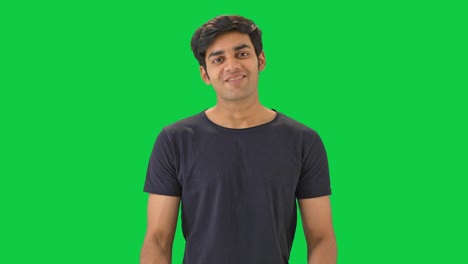 Happy-Indian-man-talking-to-someone--Green-screen