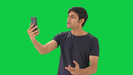Angry-Indian-boy-fighting-on-video-call-Green-screen