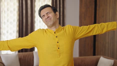 Lazy-middle-aged-Indian-man-yawning