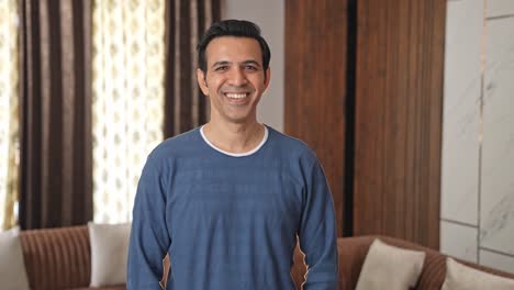Happy-middle-aged-Indian-man-smiling