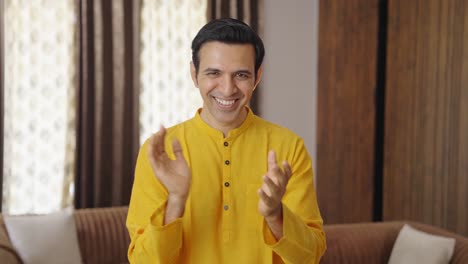 Smart-Indian-man-clapping-and-celebrating