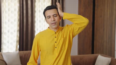 Happy-Indian-man-doing-neck-stretch-exercise