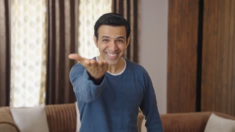 Middle-aged-Indian-man-laughing-on-someone