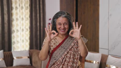 Indian-old-lady-showing-okay-sign-and-thumbs-up